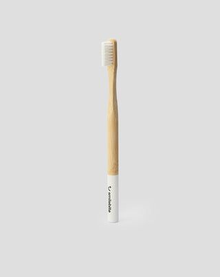 Smilebite bamboo toothbrush with white nylon bristles, suitable for vegans